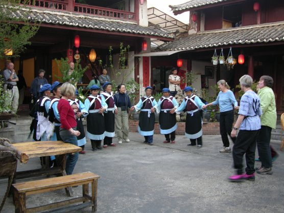 Amcan group line dancing with Naxi women