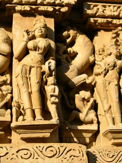 Khajuraho, India: Woman applying cosmetics